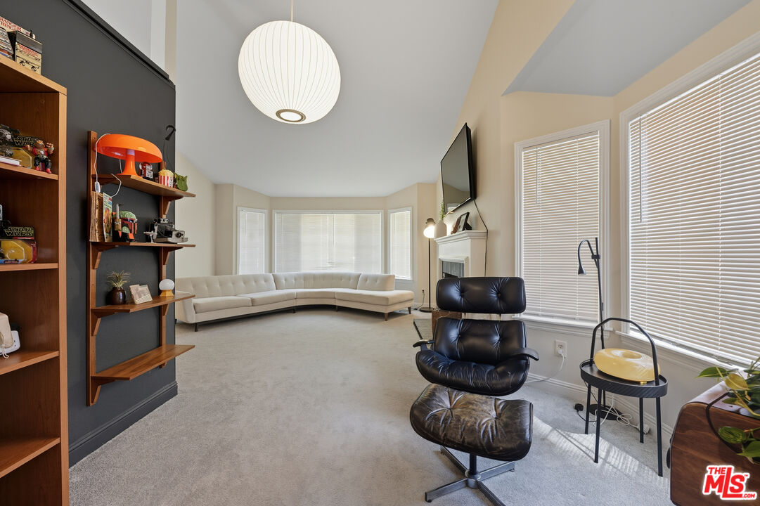 2048 East Ave R 10 Palmdale, CA 93550 - Photo 12 of 45 a living room with furniture and a large window
