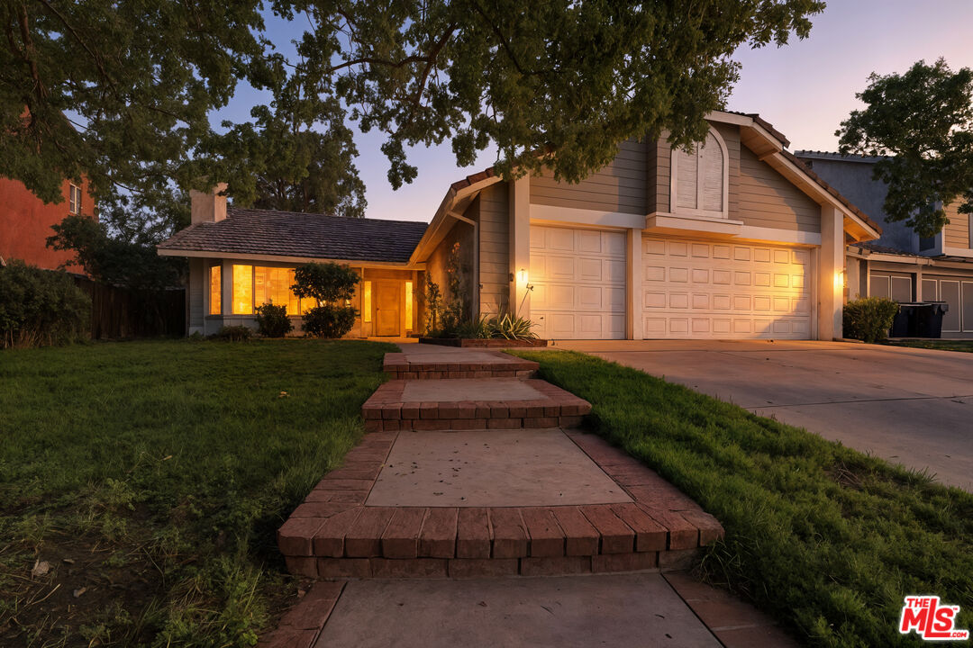 2048 East Ave R 10 Palmdale, CA 93550 - Photo 2 of 45 a front view of house with yard and green space