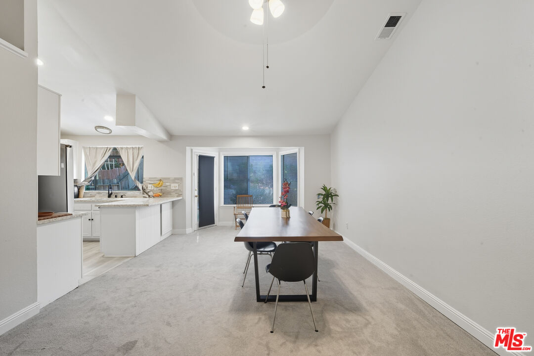 2048 East Ave R 10 Palmdale, CA 93550 - Photo 21 of 45 a living room with furniture and window