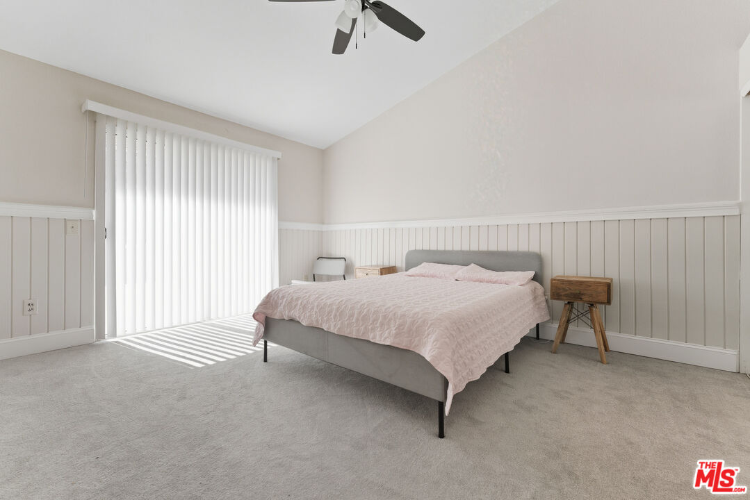 2048 East Ave R 10 Palmdale, CA 93550 - Photo 26 of 45 a bedroom with a bed and a table