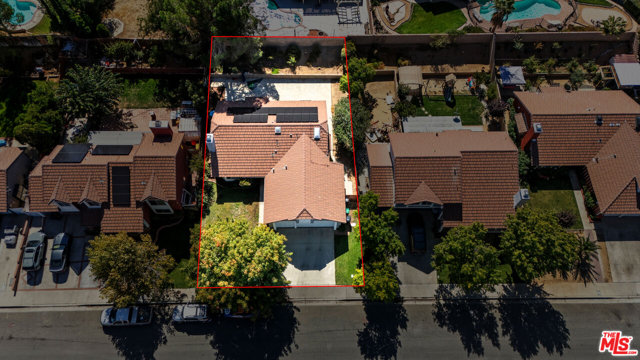 2048 East Ave R 10 Palmdale, CA 93550 - Photo 3 of 45 an aerial view of a houses with yard