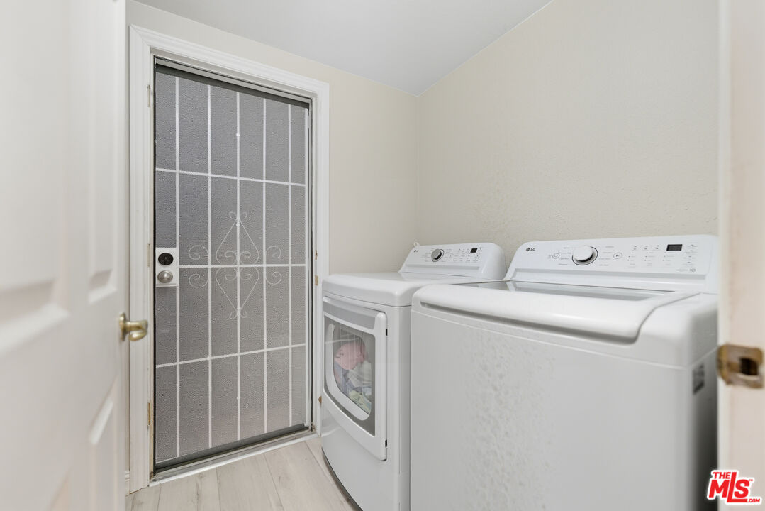 2048 East Ave R 10 Palmdale, CA 93550 - Photo 39 of 45 a utility room with dryer and washer
