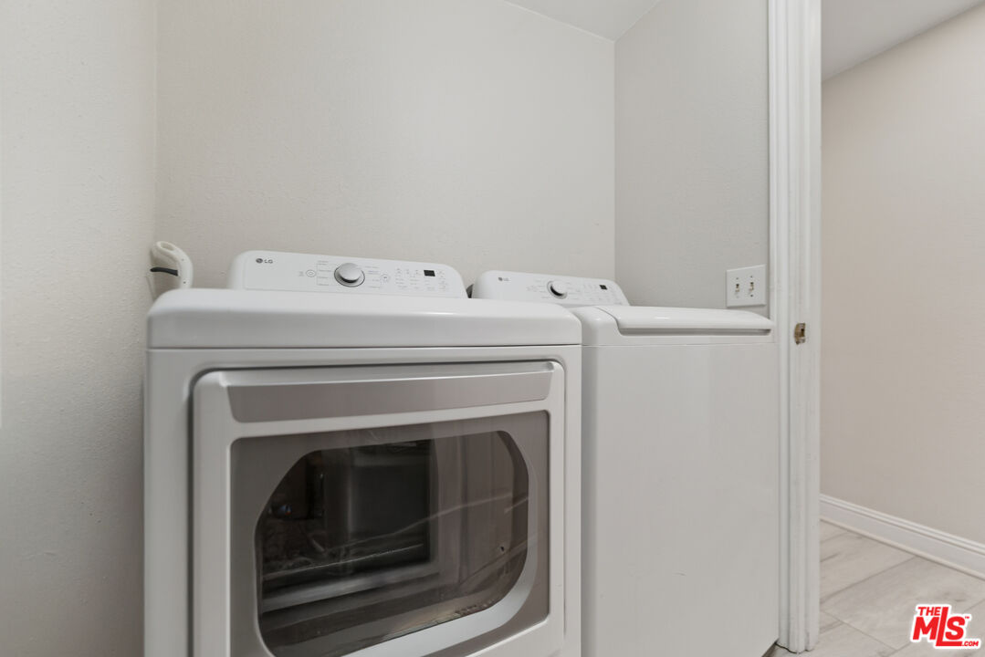 2048 East Ave R 10 Palmdale, CA 93550 - Photo 40 of 45 a utility room with dryer and washer