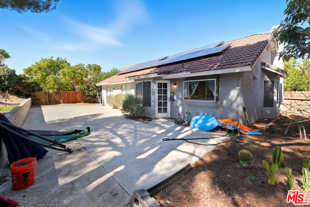 2048 East Ave R 10 Palmdale, CA 93550 - Photo 43 of 45 a front view of a house with patio