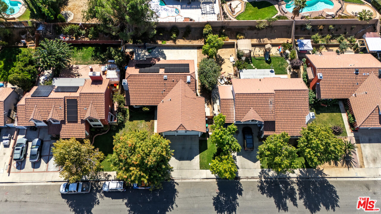 2048 East Ave R 10 Palmdale, CA 93550 - Photo 45 of 45 an aerial view of a house with a yard and potted plants