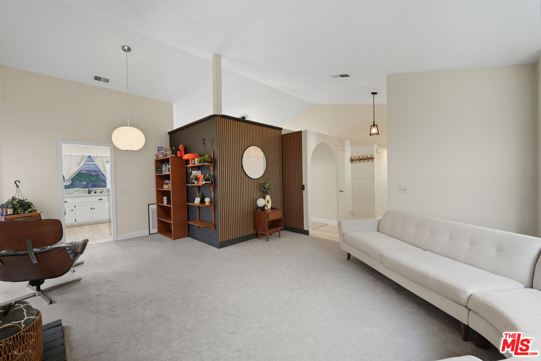 2048 East Ave R 10 Palmdale, CA 93550 - Photo 10 of 45 a living room with furniture and a air conditioner vent