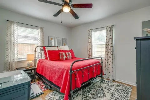 a bedroom with bed and window