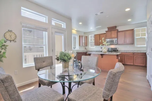 a dining room with furniture and window