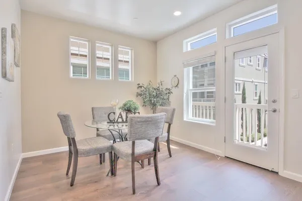 a dining room with furniture and window