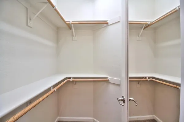 a view of a room with shelf on the wall