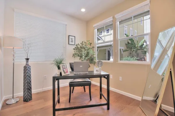 a dining room with furniture and window