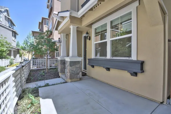 front view of a house with a large window