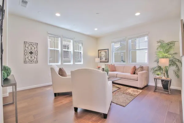 a living room with furniture and windows