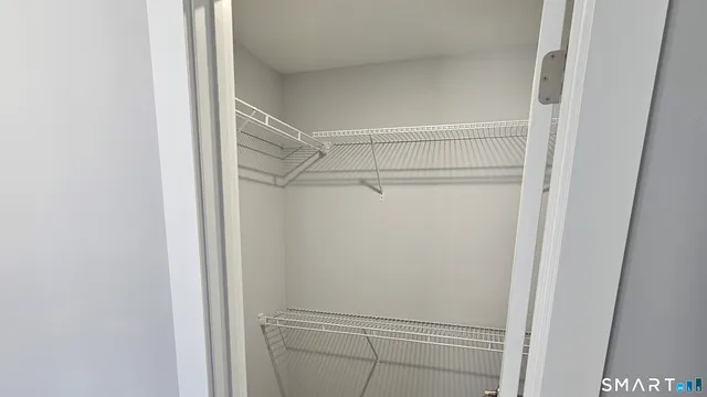 a view of an empty walk in closet