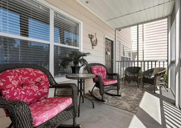 a view of a patio with a table and chairs