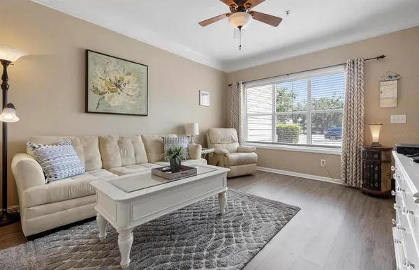 a living room with furniture and a window