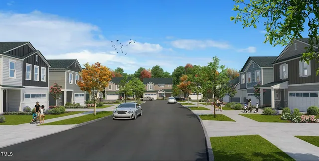a city street lined with buildings and trees