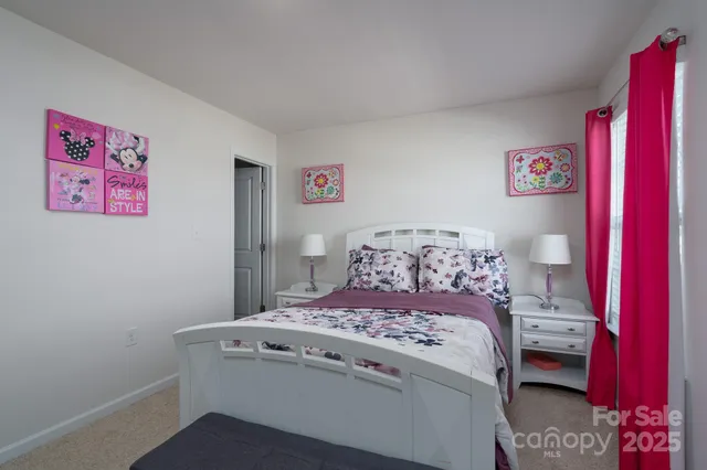a utility room with a bed and a desk