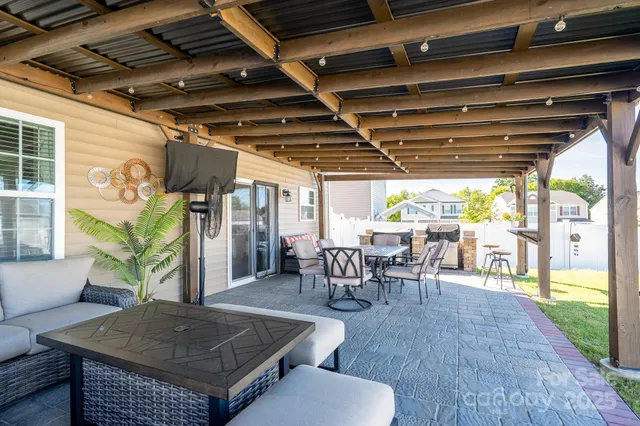 a view of a porch with furniture and a table
