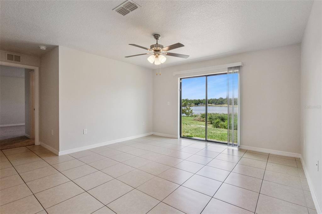 1613 Orne Street Mascotte, FL 34753 - Photo 9 of 31 a view of an empty room with a window
