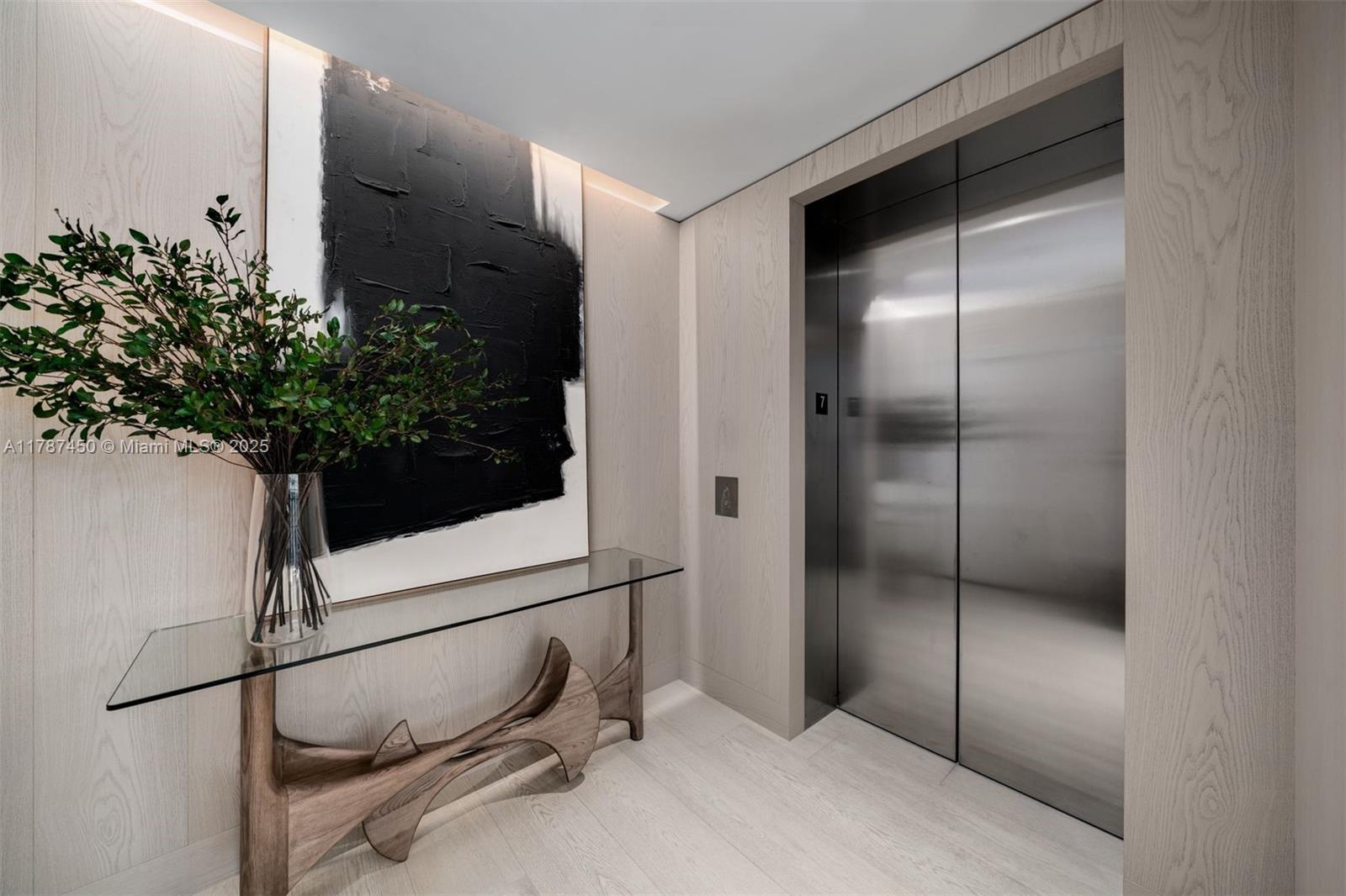 8955 Collins Avenue, Unit 702 Surfside, FL 33154 - Photo 23 of 42 a bathroom with a shower and a plant in it