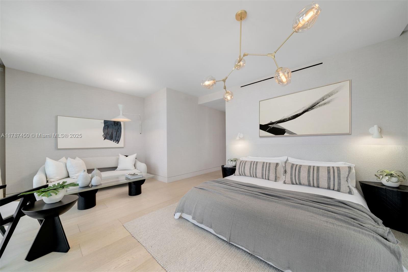 8955 Collins Avenue, Unit 702 Surfside, FL 33154 - Photo 29 of 42 a bedroom with furniture and a bed