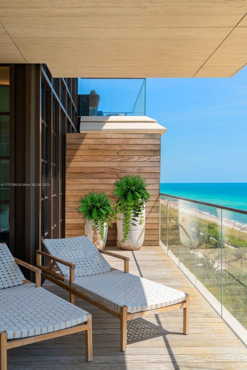 8955 Collins Avenue, Unit 702 Surfside, FL 33154 - Photo 37 of 42 a outdoor space with a table and chairs