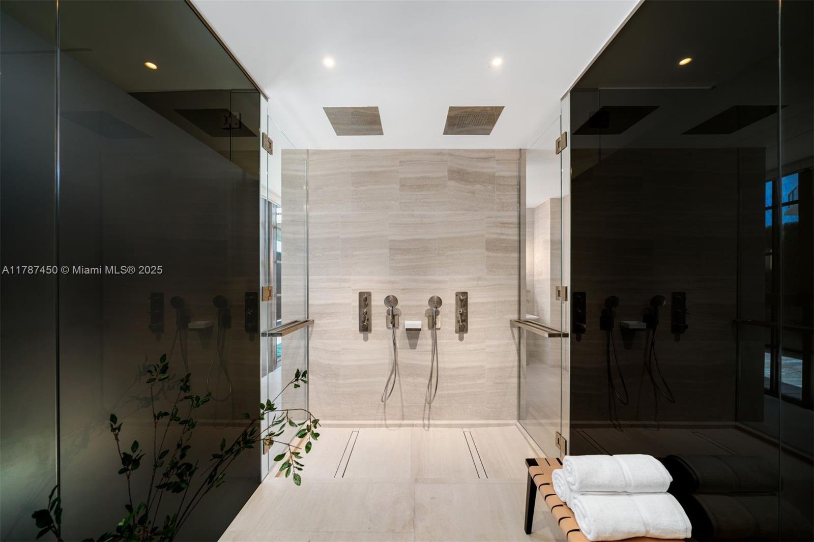 8955 Collins Avenue, Unit 702 Surfside, FL 33154 - Photo 8 of 42 a lobby with furniture and a rug