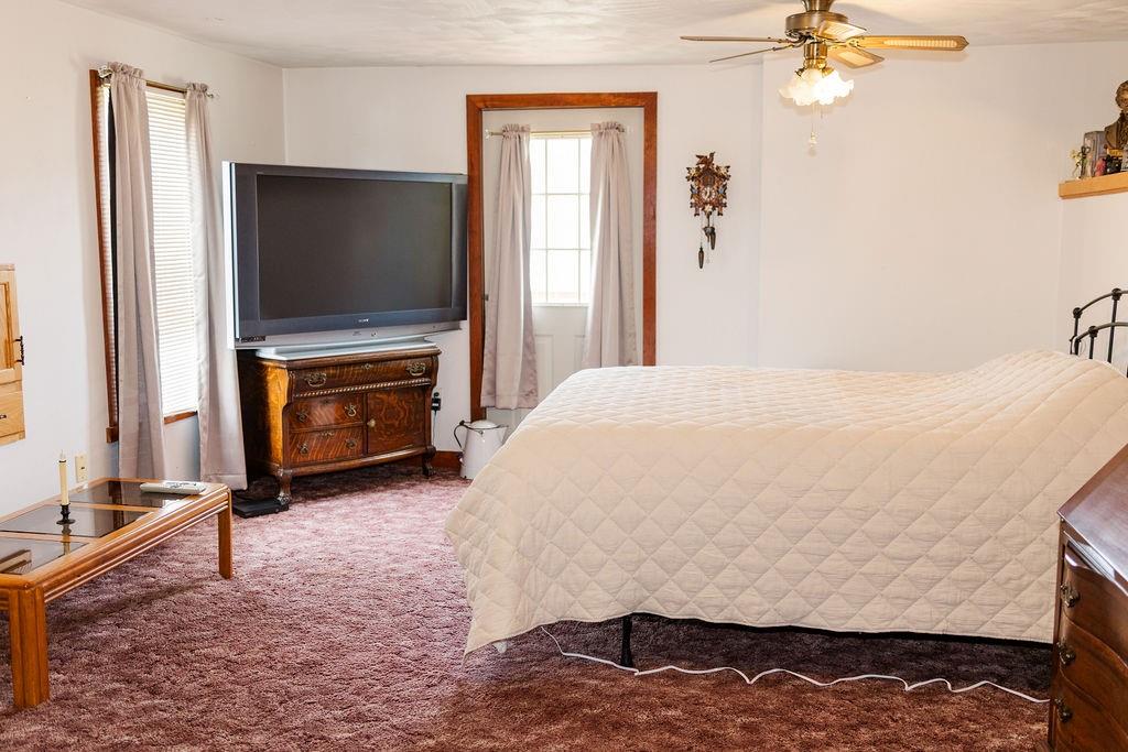 1898 Schellsburg Road Claysburg, PA 16625 - Photo 29 of 50 a bedroom with a bed and a flat screen tv