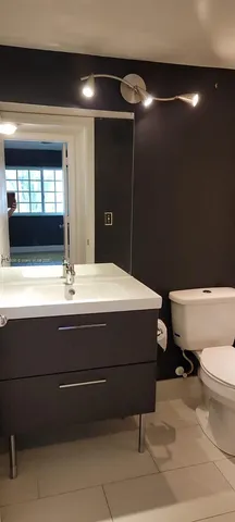 a bathroom with a sink and a toilet