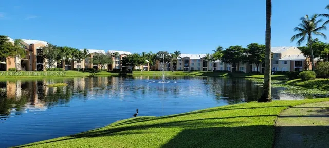 a view of a lake with a yard