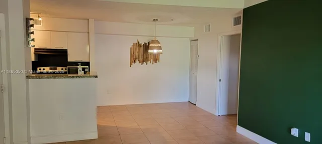 a view of a livingroom with wooden floor