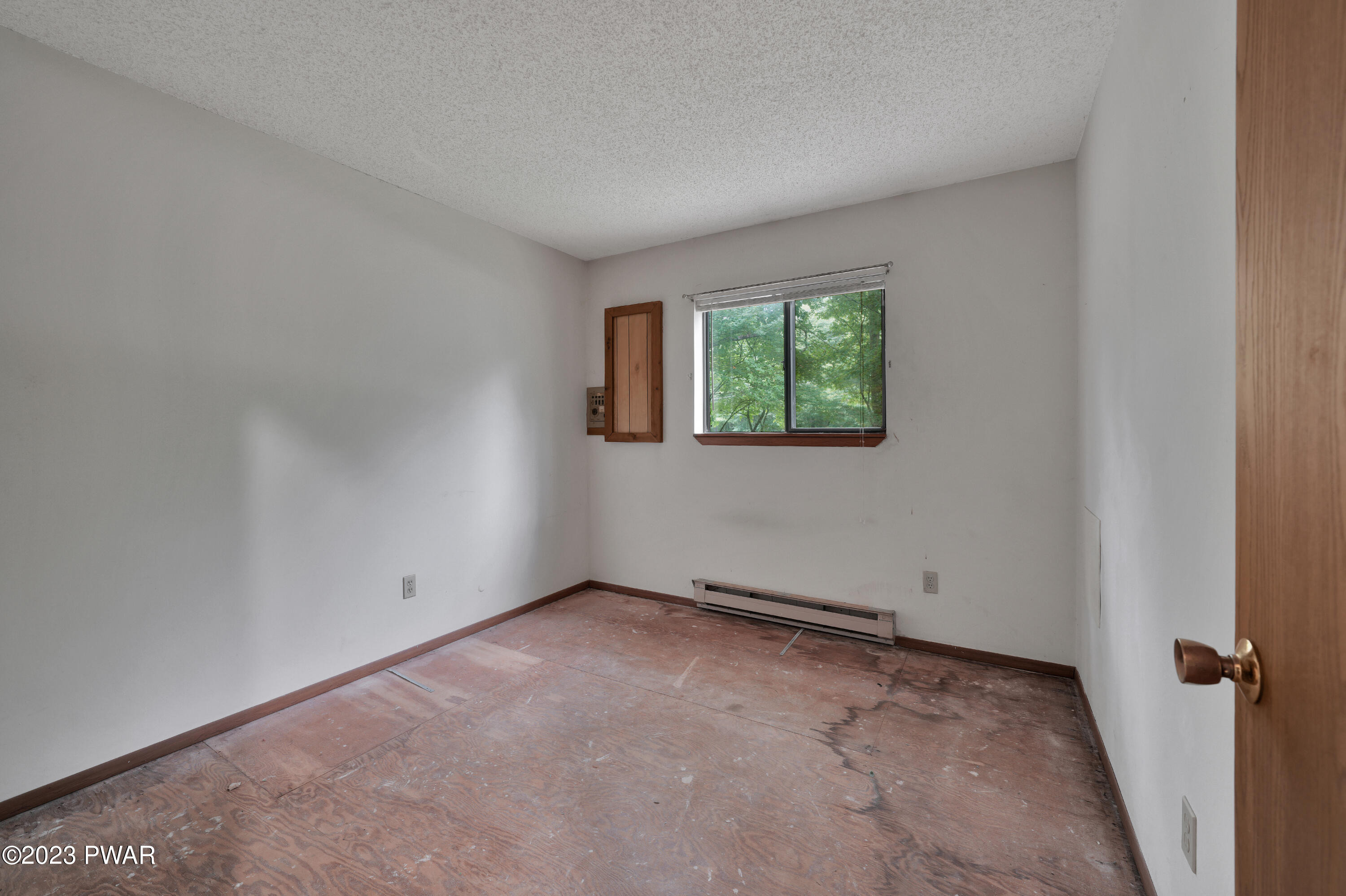 163 Roundhill Road Dingmans Ferry, PA 18328 - Photo 21 of 25 an empty room with windows