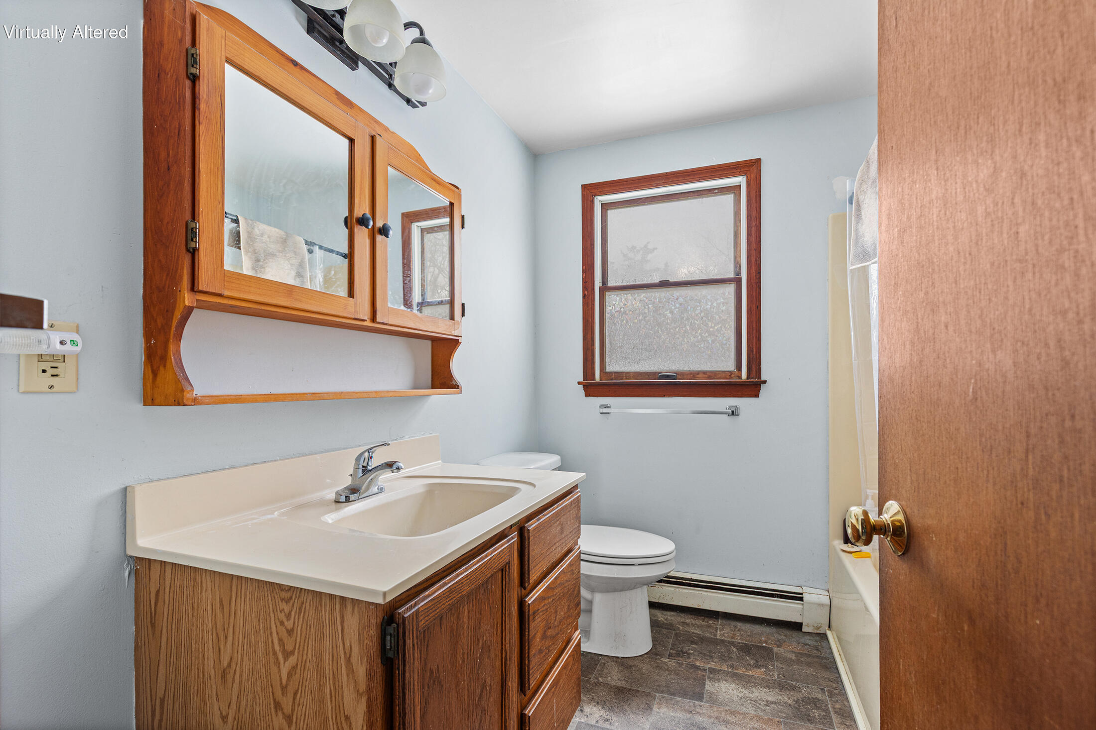 600 Kingsbury Beach Road Eastham, MA 02642 - Photo 13 of 29 a bathroom with a toilet sink and mirror