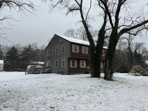 a view of a car parked in front of a house