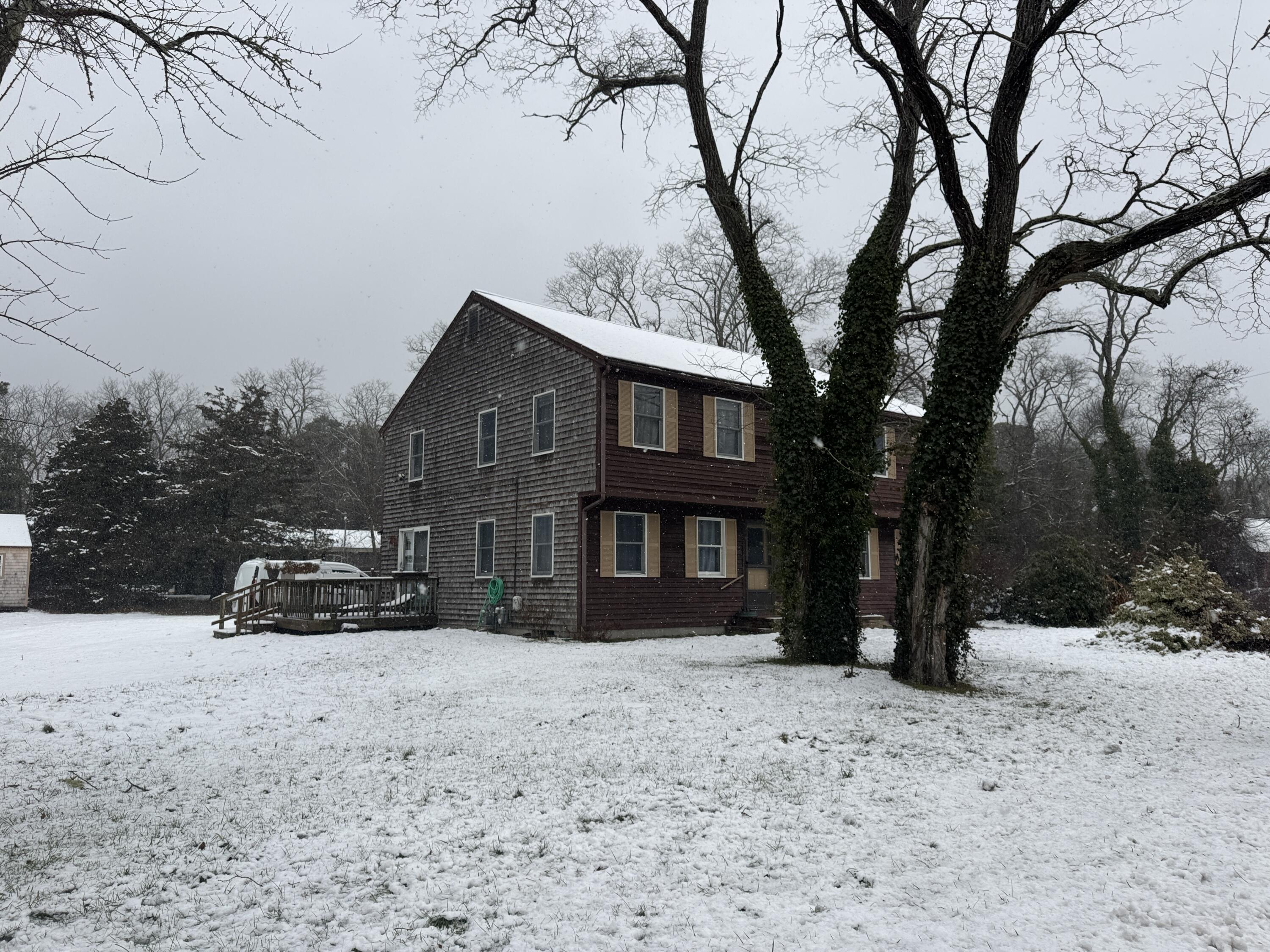 600 Kingsbury Beach Road Eastham, MA 02642 - Photo 3 of 29 a view of a car parked in front of a house