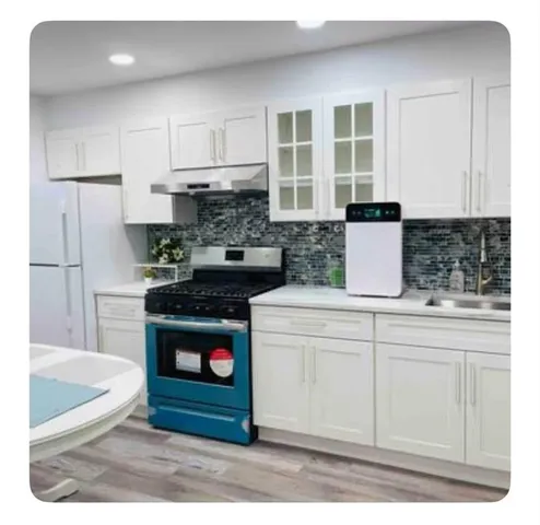 a kitchen with stainless steel appliances granite countertop a stove a refrigerator and a granite counter tops