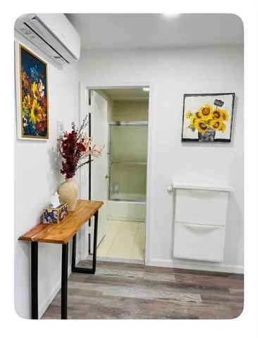 a view of a dinning room with a table and chairs