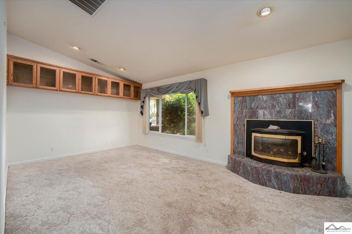 19950 Red Bank Road Red Bluff, CA 96080 - Photo 13 of 69 a view of an empty room with a fireplace and a window