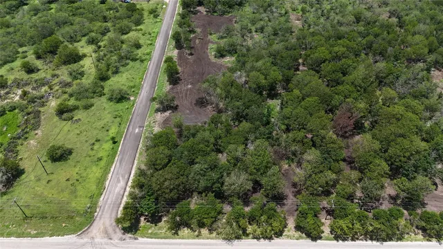 an aerial view of residential house with outdoor space