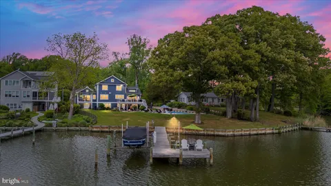 a view of a lake with a house in the background