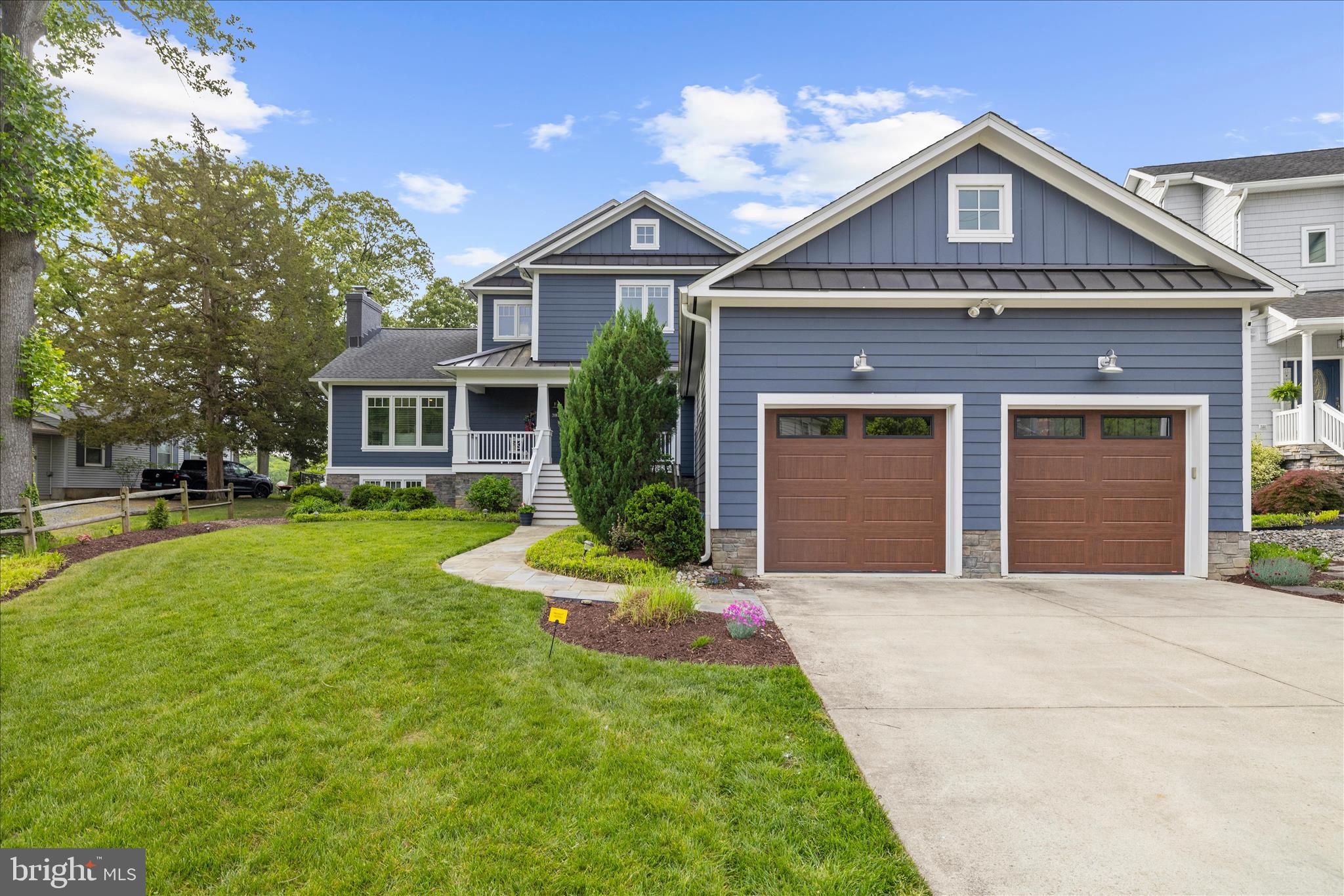 3815 Outrigger Drive Edgewater, MD 21037 - Photo 108 of 114 a front view of a house with a yard and garage