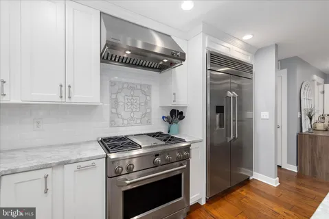 a utility room with sink dryer and washer