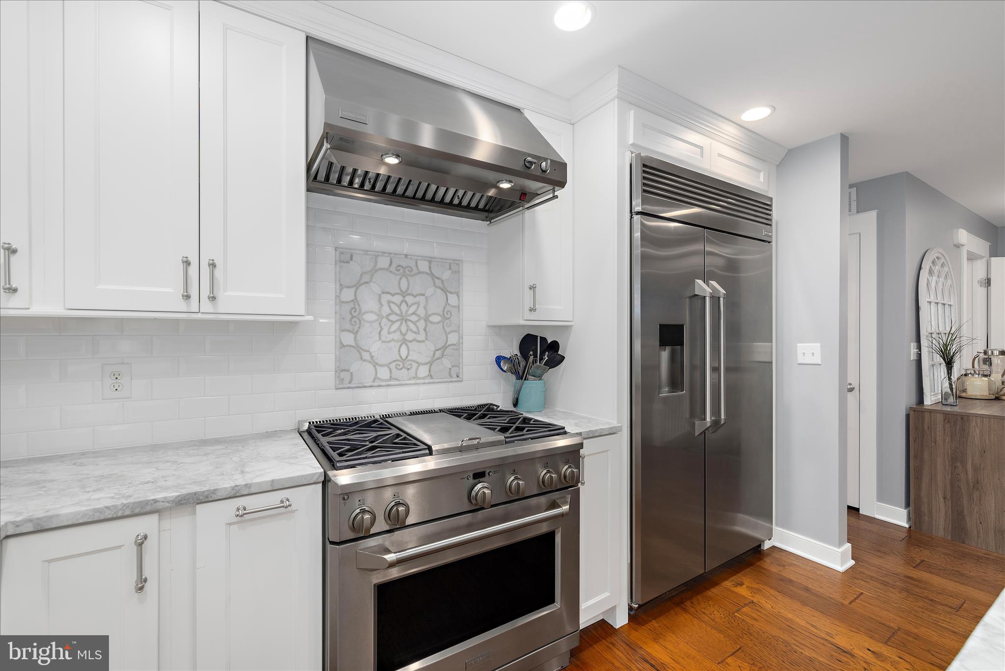 3815 Outrigger Drive Edgewater, MD 21037 - Photo 14 of 114 a kitchen with stainless steel appliances granite countertop a refrigerator a stove and a sink