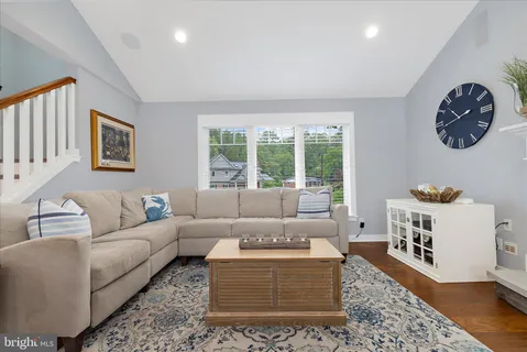 a bed room with a bed and a chair