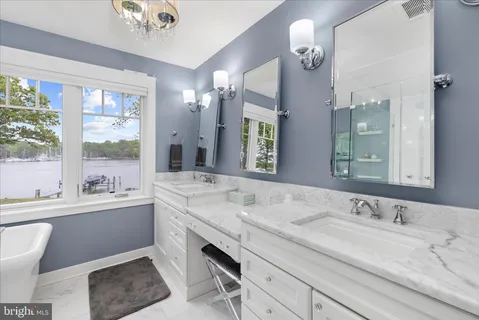 a bathroom with a toilet a sink and a mirror