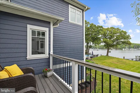 a view of residential houses with outdoor space and lake view