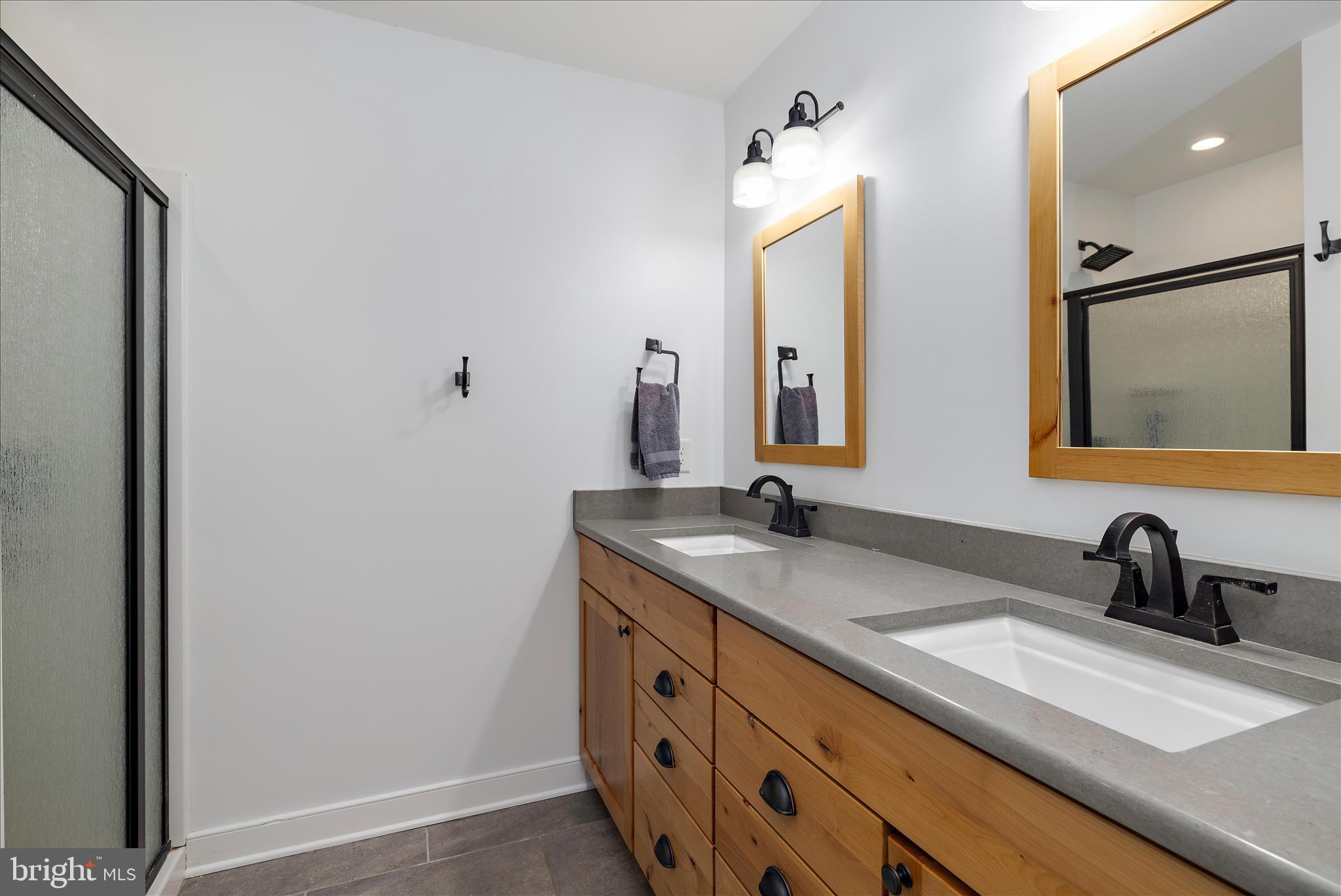 3815 Outrigger Drive Edgewater, MD 21037 - Photo 43 of 114 a bathroom with a double vanity sink and mirror