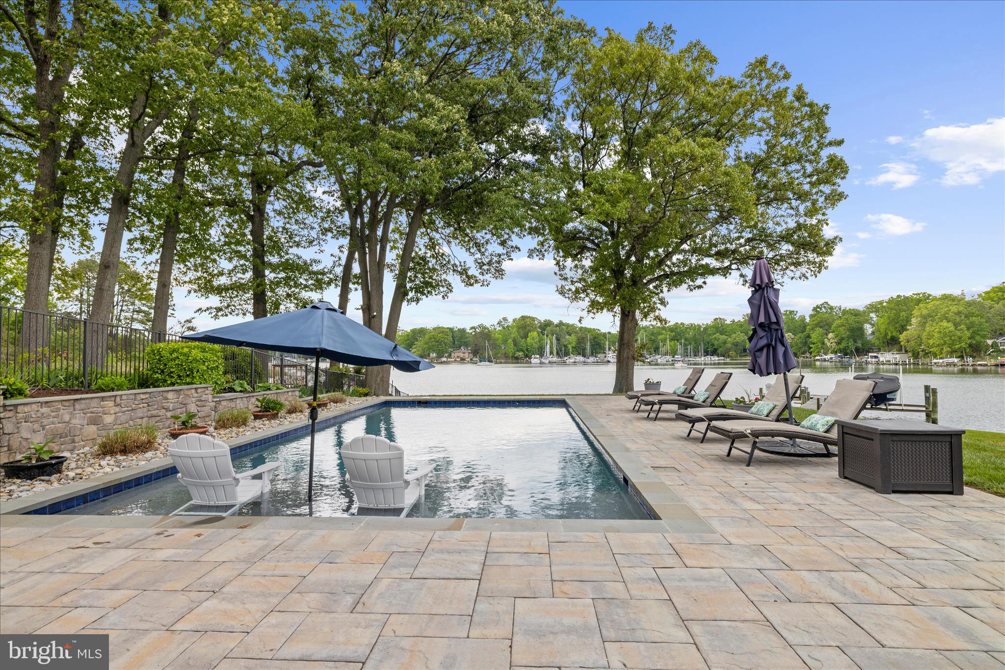 3815 Outrigger Drive Edgewater, MD 21037 - Photo 70 of 114 a view of a patio with a table and chairs under an umbrella