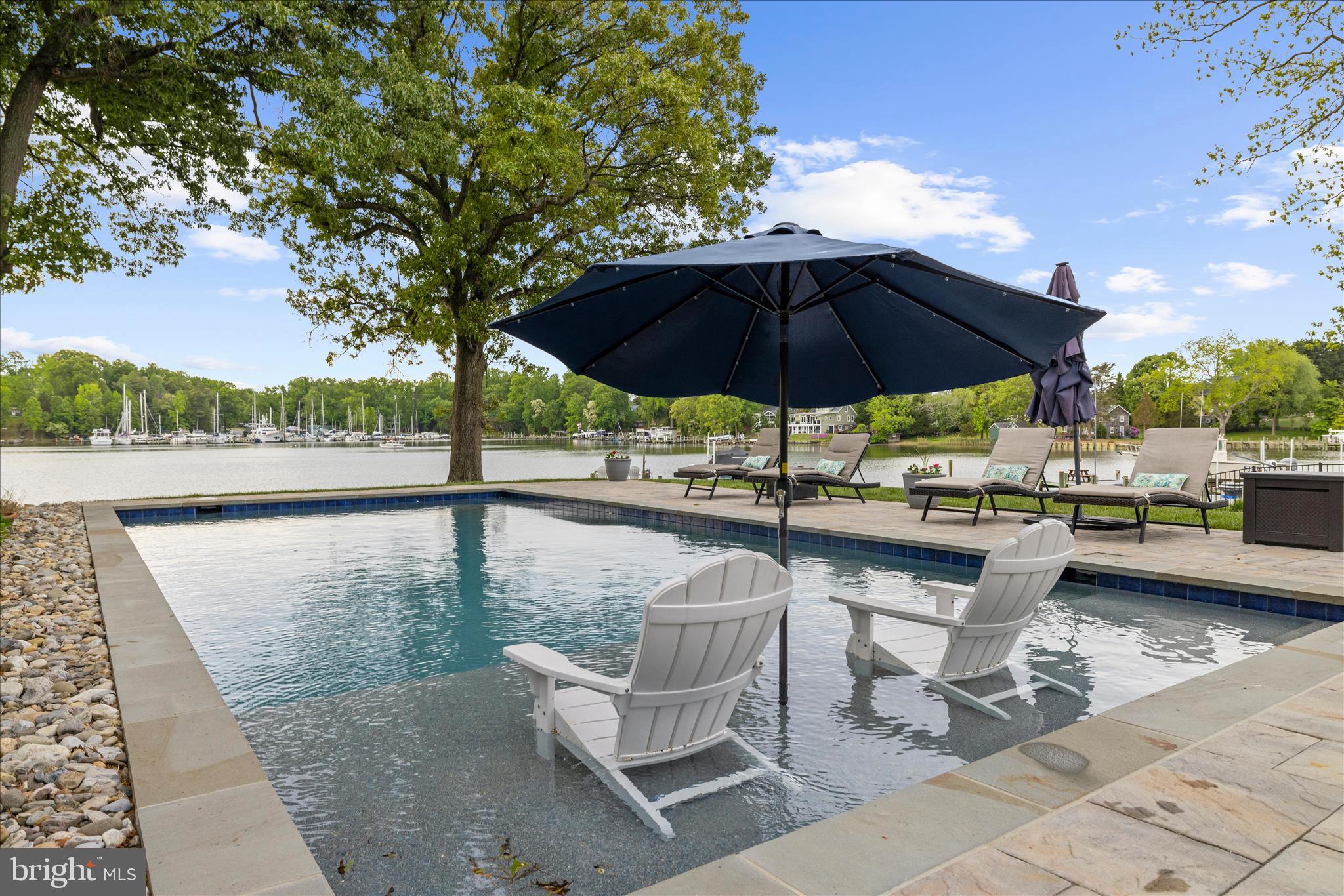 3815 Outrigger Drive Edgewater, MD 21037 - Photo 71 of 114 a view of a swimming pool with lounge chairs